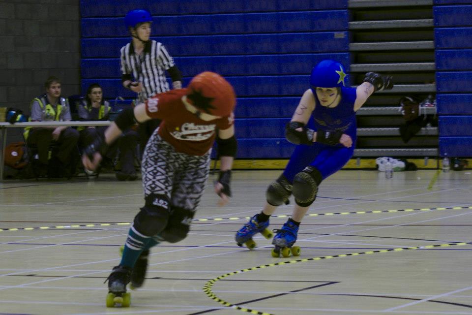 Ciderella chases down Circuit Breaker in one of the several jammer-on-jammer duels in the bout.