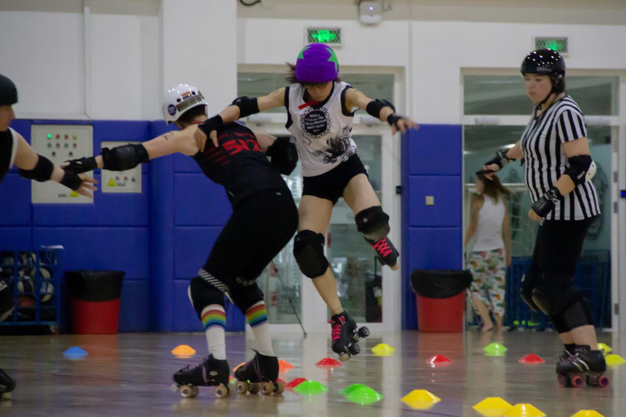 Apex jump by skater during the closing scrimmage.