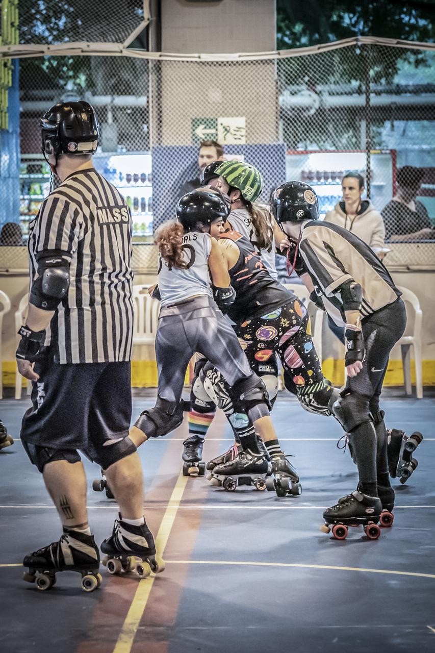 Two of UAE All-Stars' skaters (Mean Curls, Spinky) in blue as part of the Pan-Asian Spring Rollers team against hosts Hong Kong Roller Derby. Photograph by Teddy Tse